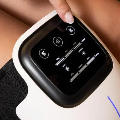 Red light knee massager control panel showing adjustable intensity and therapy settings