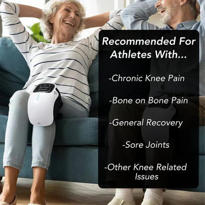 User wearing red light knee massager while relaxing for at-home muscle and joint comfort